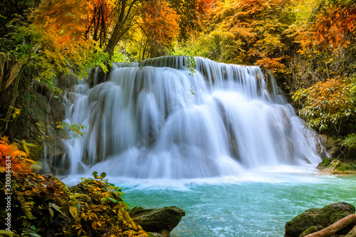 Fototapeta Naklejka Na Ścianę i Meble -  Colorful majestic waterfall in national park forest during autumn - Image
