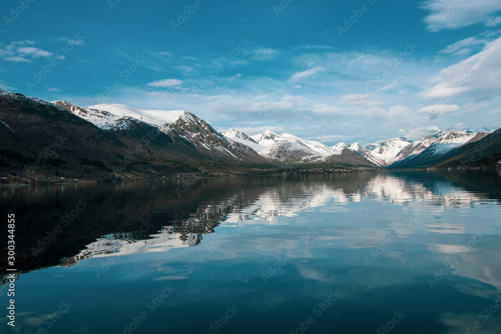 Sunny day at Beautiful Norway With calm and reflective waters 