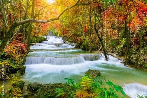 Fototapeta Naklejka Na Ścianę i Meble -  Colorful majestic waterfall in national park forest during autumn - Image