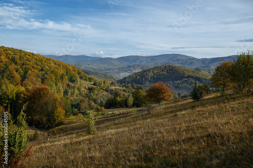 autumn mountains with haze of rising clouds © Andrii
