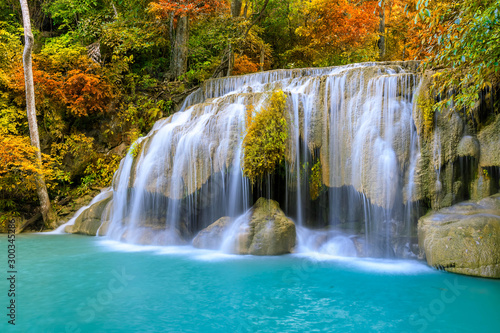 Colorful majestic waterfall in national park forest during autumn © wirojsid