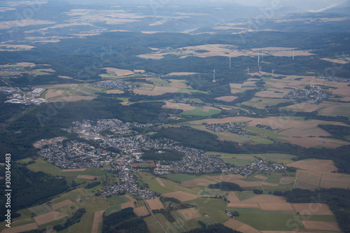  windmills station with propellers generating alternative clean green power in Germany,2019