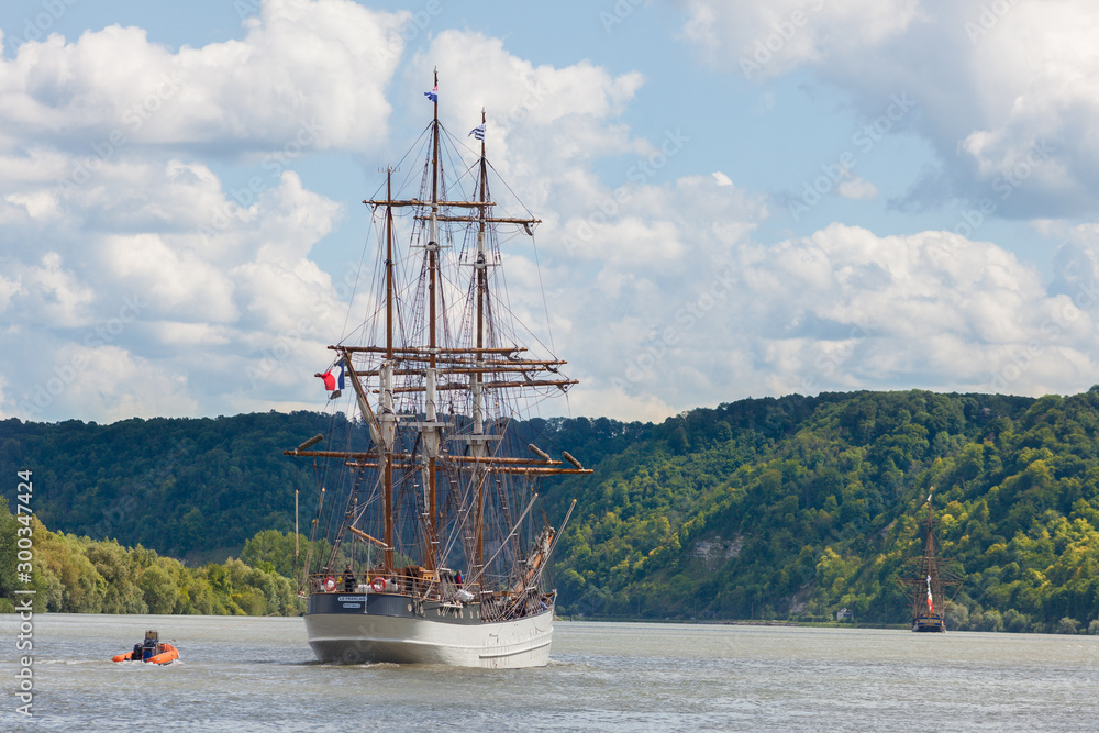 Tall ship Le Français sailing on the Seine River, through green lush countryside, Armada 2019, Normandy, France Tall ship Le Français sailing on the Seine River, through green lush countryside, Armada 2019, Normandy, France