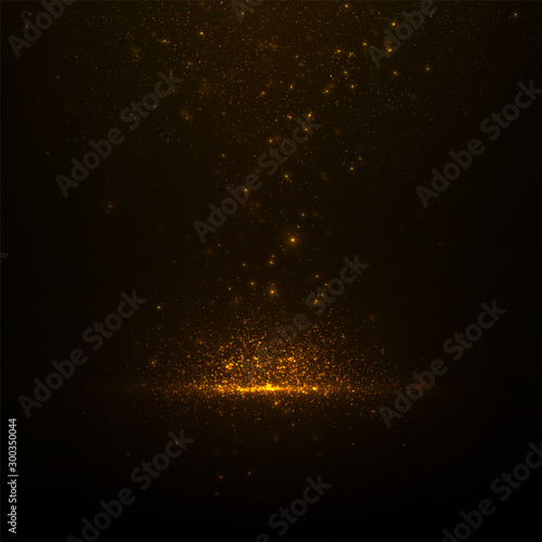 Abstract luxury background with sparkling golden dust and glowing particles