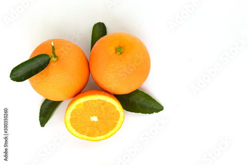 oranges with leaves isolated on white background © Theeranad