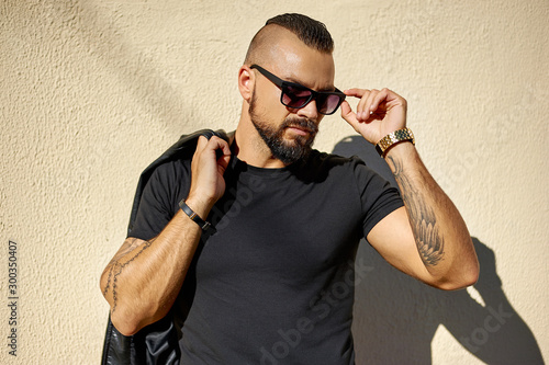 Handsome brutal man wearing sunglasses