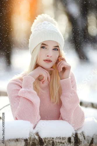 Beautiful young woman in winter forest