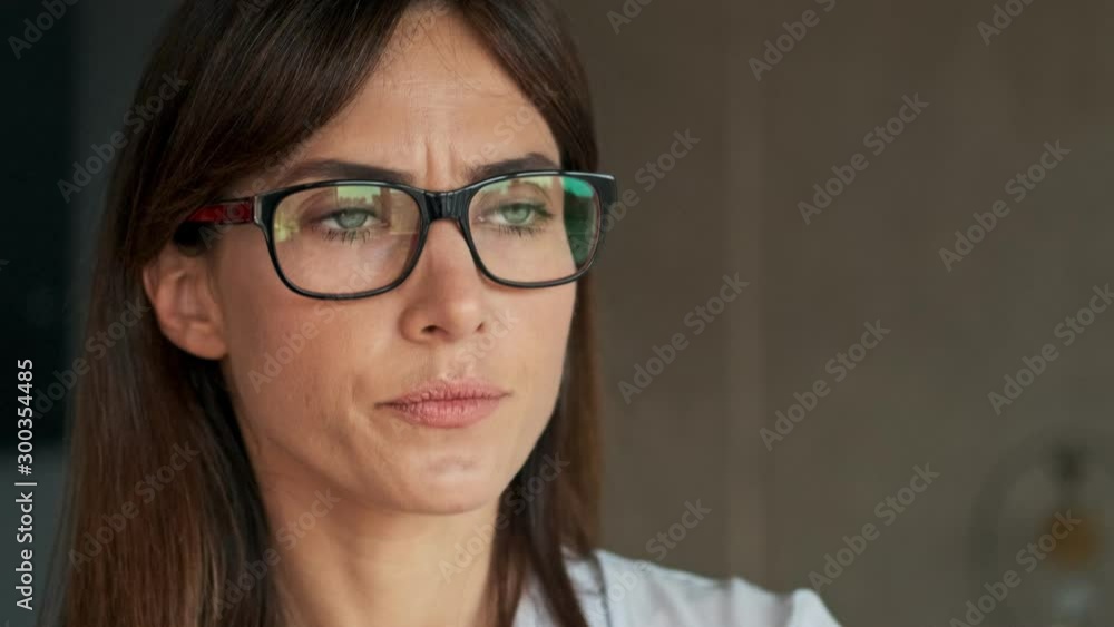Cropped view of displeased pretty young business woman feeling worried and angry while working at home Cropped view of displeased pretty young business woman feeling worried and angry while working at home