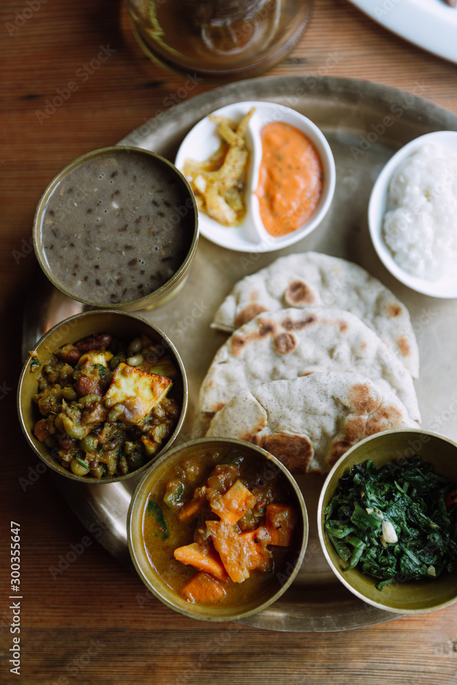 Top view of Nepali vegetarian set. Bowls with different curry Top view of Nepali vegetarian set. Bowls with different curry