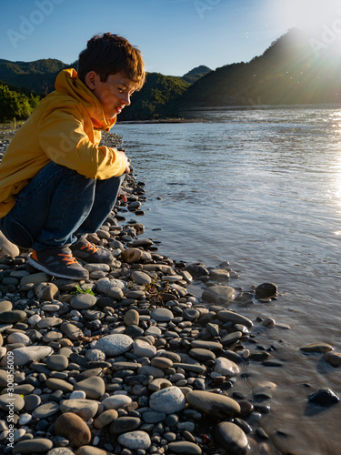 The teenager boy on mountain river beach © Chepko Danil
