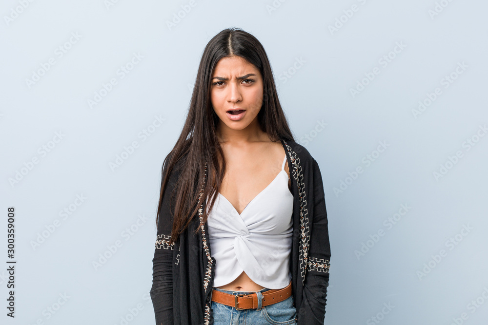 Young natural and pretty arab woman screaming very angry and aggressive. Young natural and pretty arab woman screaming very angry and aggressive.