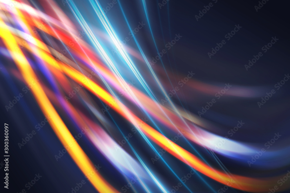 Multicolored blurred lines on a dark abstract background, neon glow Multicolored blurred lines on a dark abstract background, neon glow