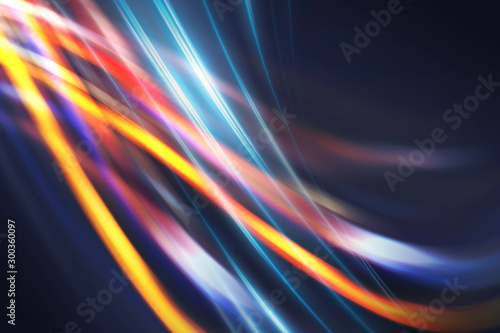 Multicolored blurred lines on a dark abstract background, neon glow