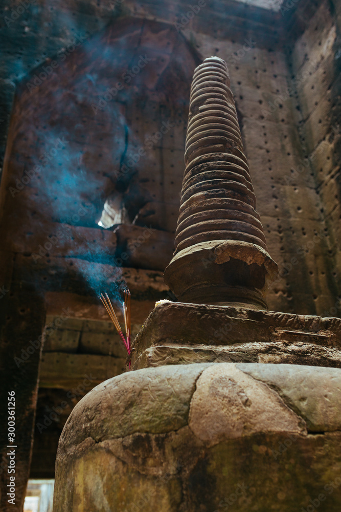 Incense sticks and candles in the templeBuddha worship place Angkor Wat Temple in Cambodia near Siem Reap city in Asia Incense sticks and candles in the templeBuddha worship place Angkor Wat Temple in Cambodia near Siem Reap city in Asia