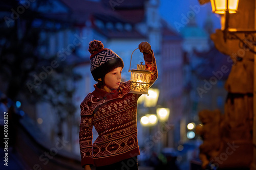 Photography Beautiful preschool child, holding lantern, casually dressed, looking at night v