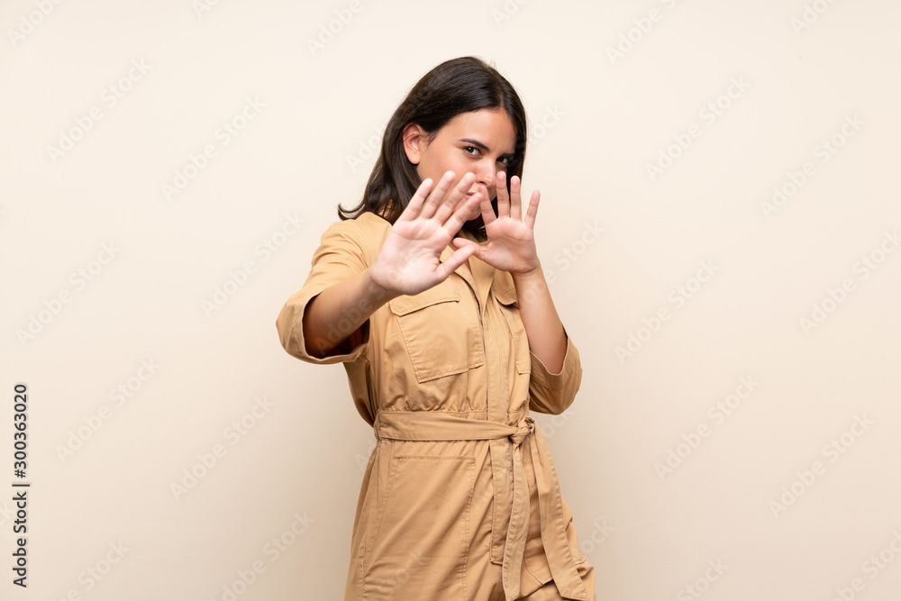 Young girl over isolated background nervous stretching hands to the front Young girl over isolated background nervous stretching hands to the front