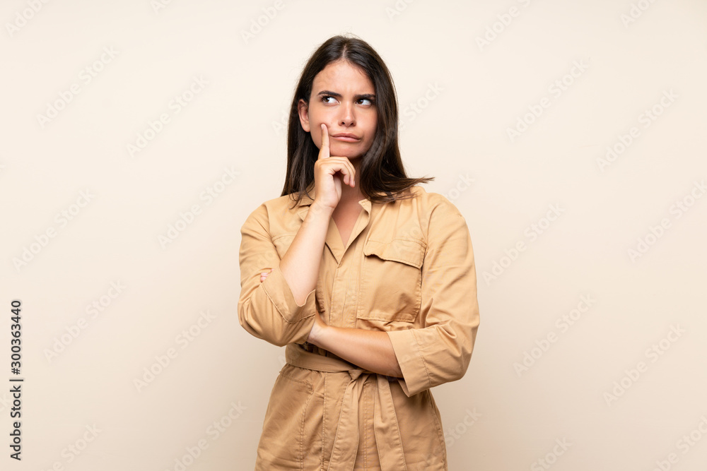 Young girl over isolated background Looking front Young girl over isolated background Looking front