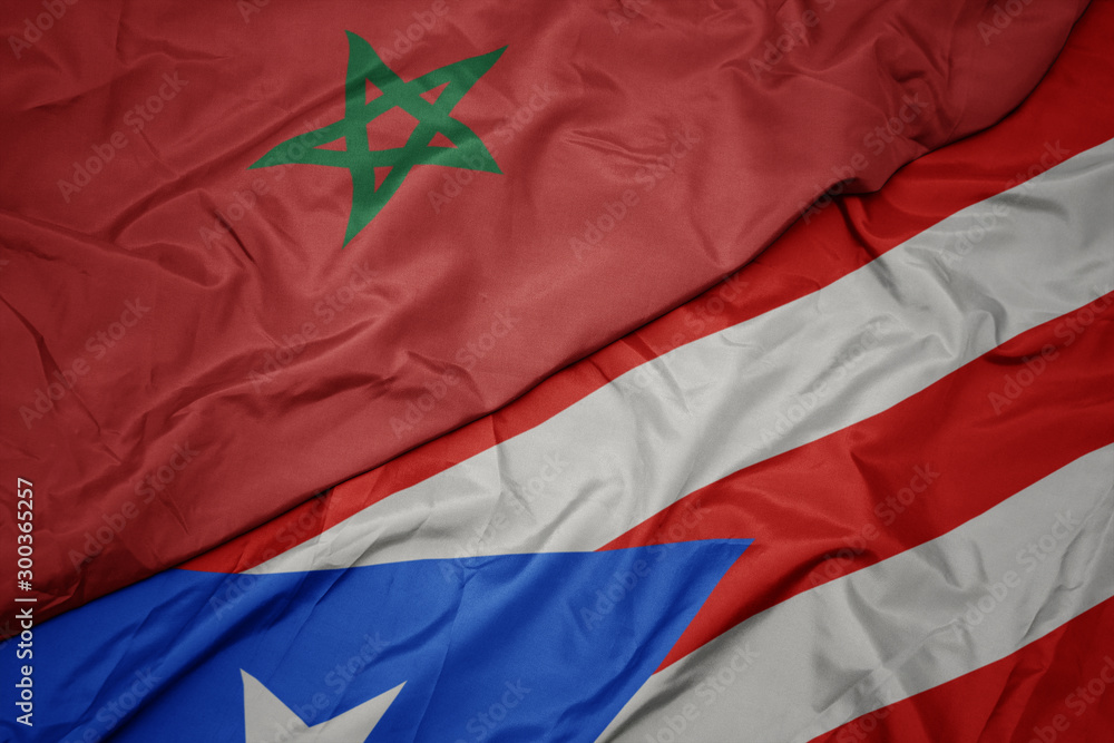 waving colorful flag of puerto rico and national flag of morocco.