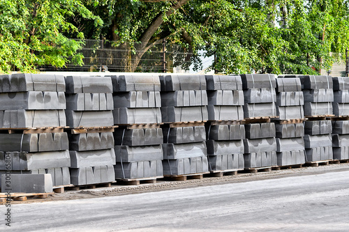 Curbstone on pallets for construction of road on the street photo