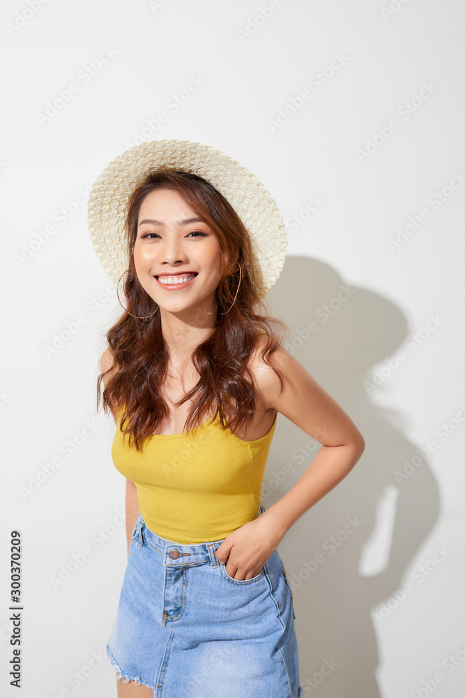 A portrait of a beautiful young asian woman wearing round hat A portrait of a beautiful young asian woman wearing round hat