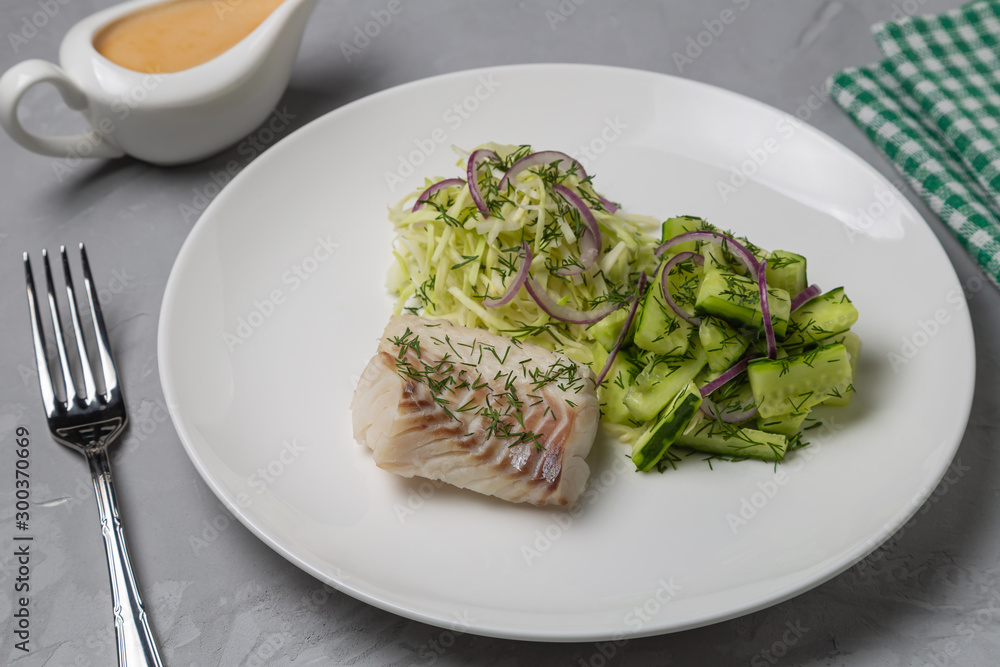Boiled cod salad with cucumber, cabbage and red onion. Dish for people with diabetes and overweight Boiled cod salad with cucumber, cabbage and red onion. Dish for people with diabetes and overweight
