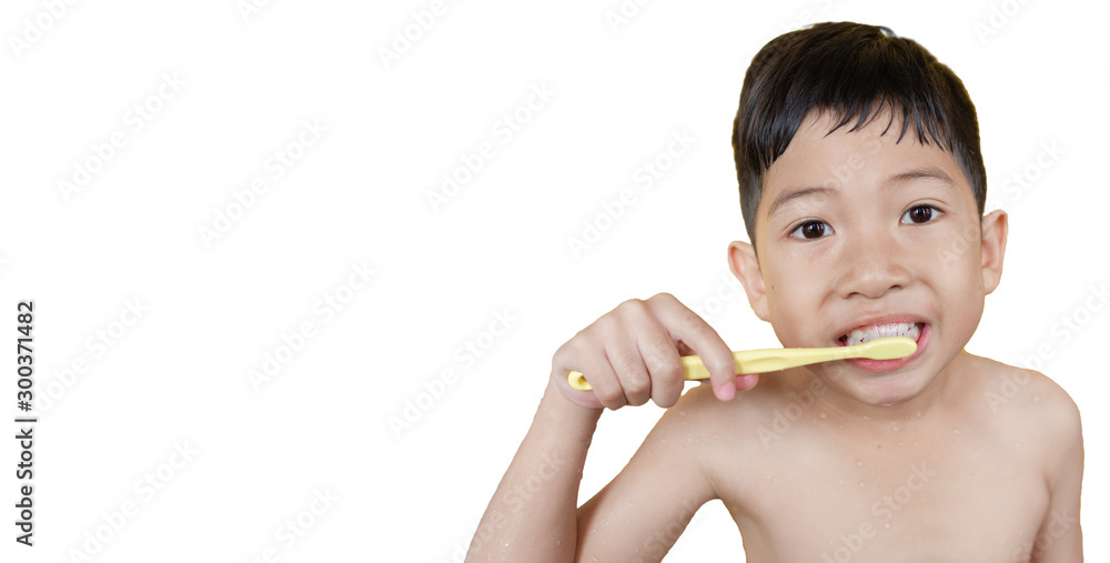 Asian boy is brushing his teeth while bathing on a white background Asian boy is brushing his teeth while bathing on a white background