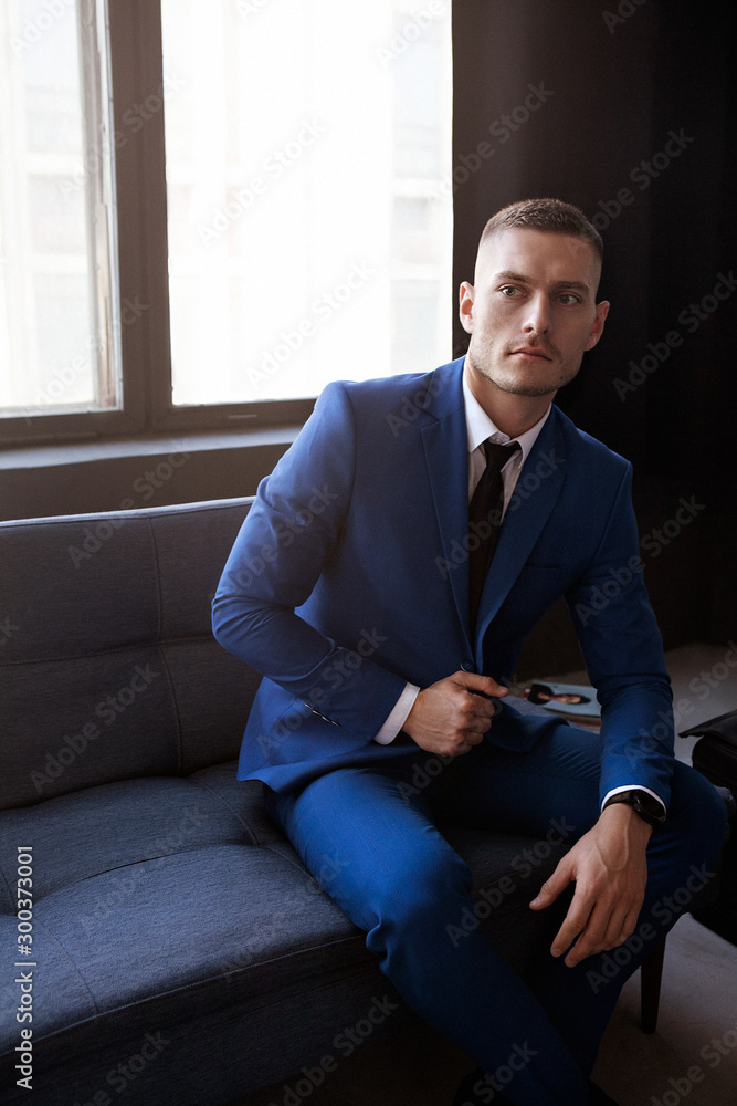 Stylish young man in a suit and tie. Business style. Fashionable image. Evening dress. Stylish young man in a suit and tie. Business style. Fashionable image. Evening dress.