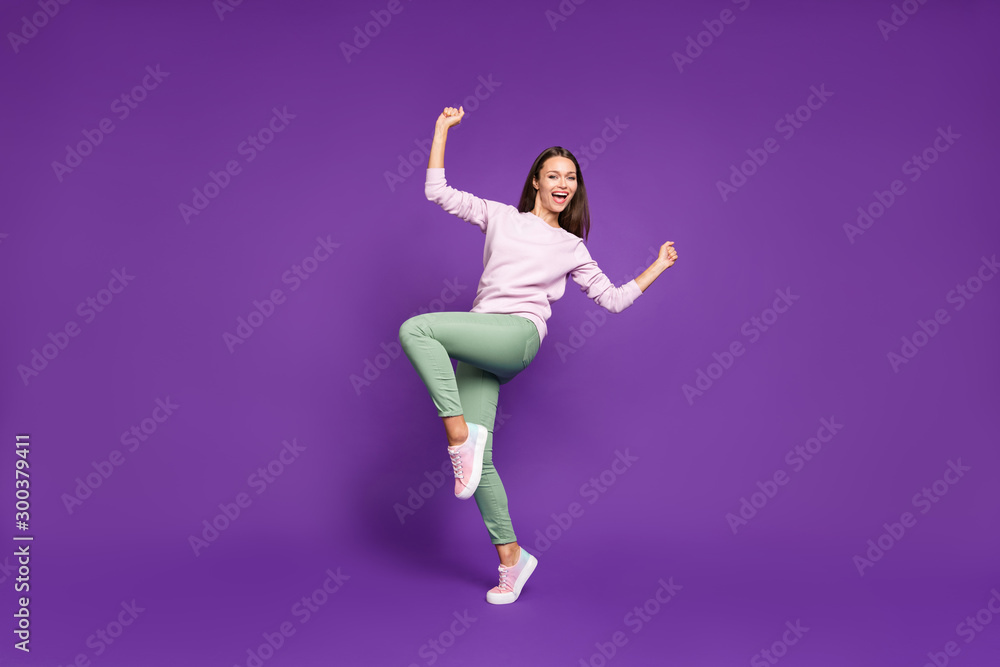 Full length body size turned photo of sweet charming cute girlfriend excited about having won ticket to local discotheque rejoicing isolated over purple vivid color background