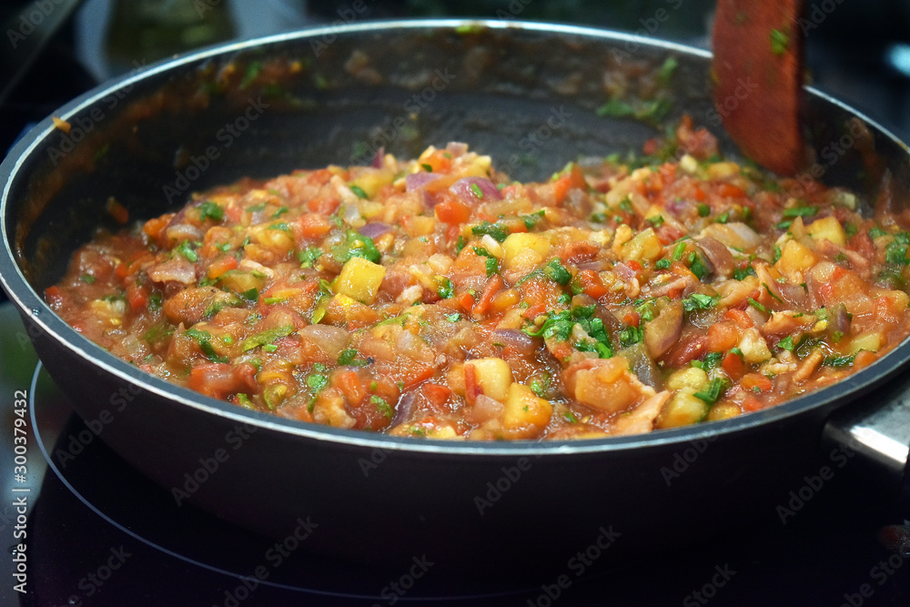 cooking vegetable sauce in a pan