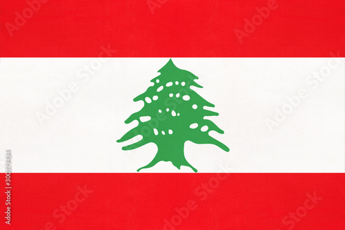 Lebanon national fabric flag, textile background. Lebanese state official sign.