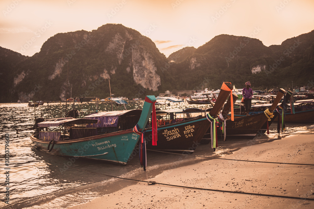 Boats in Phi Phi beach at sunset, Thailand Boats in Phi Phi beach at sunset, Thailand