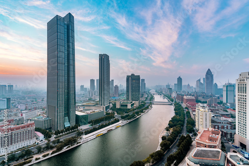 Early morning scenery of the city skyscrapers along the Haihe River in Tianjin, China