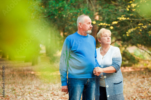 Pensioners walk in the park. Happy old age.