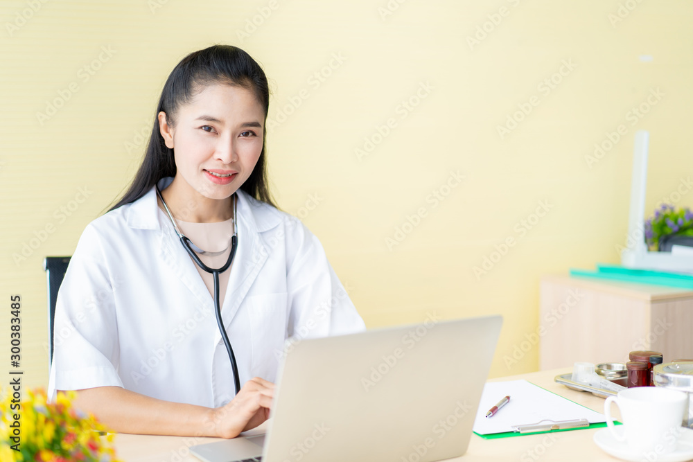 Asian woman doctor woking in the doctor office in hospital. Asian woman doctor woking in the doctor office in hospital.