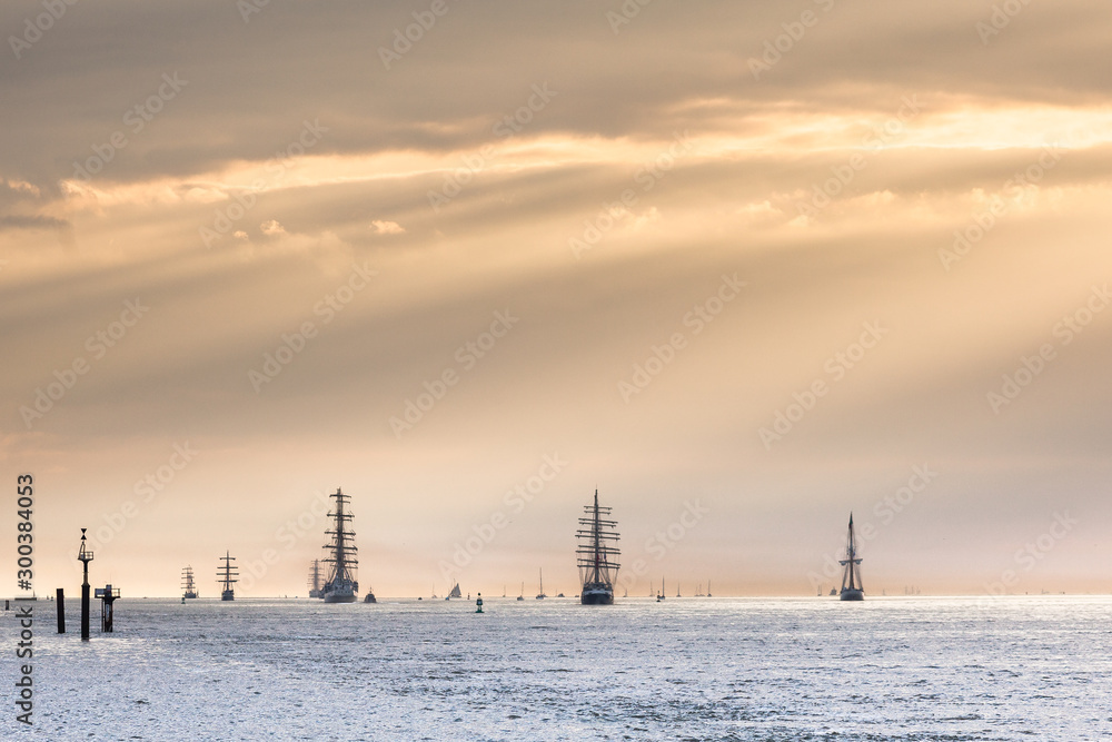 Tall ships leaving the Seine Estuary in the setting sun, Armada 2019, Normandy, France