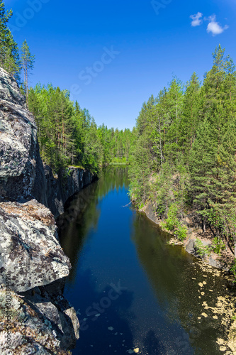 Forest lake in a rocky canyon.
