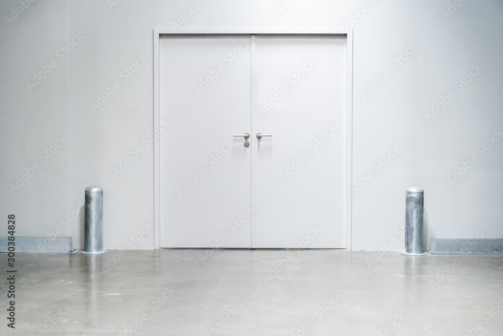 Double doors with security lock in warehouse close up. Double doors with security lock in warehouse close up.