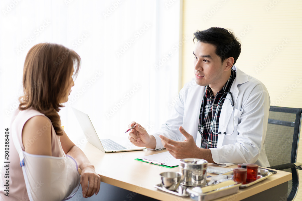 Specialist doctor explain and show the examination result on laptop computer to his patient in hospital. Specialist doctor explain and show the examination result on laptop computer to his patient in hospital.