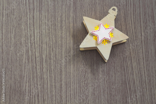 White star on yellow star on a wooden background