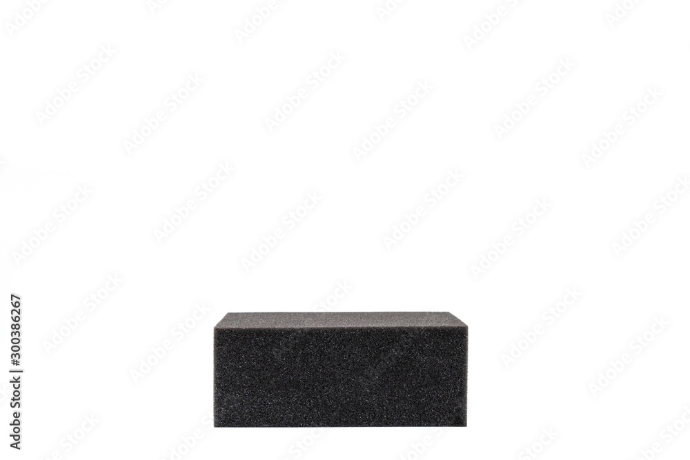 Cube of black sponge close up isolated on white background. Cube of black sponge close up isolated on white background.