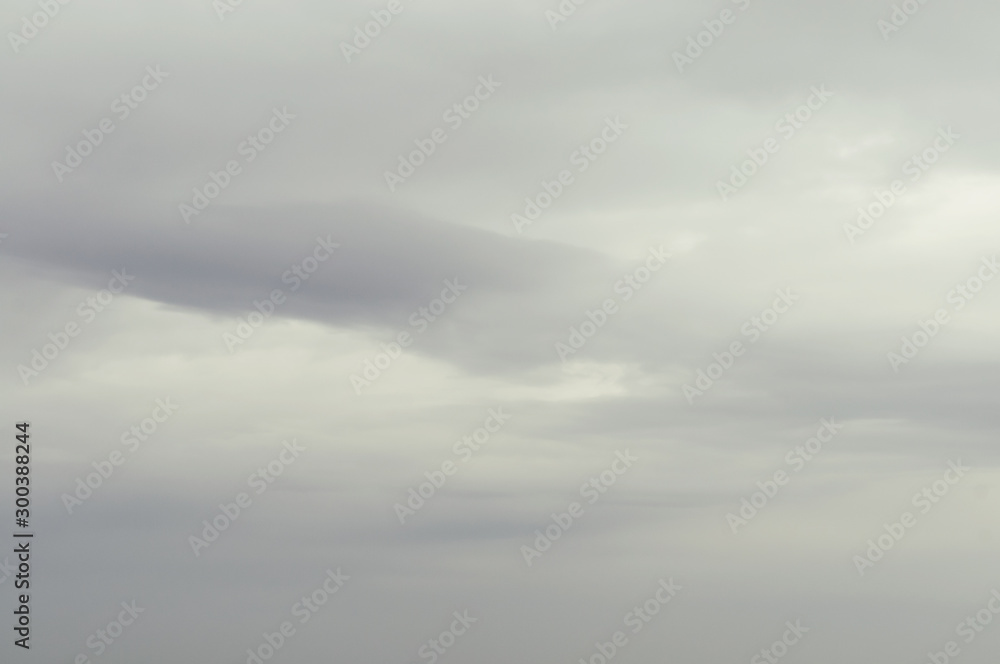 Soft background with stratus clouds. Dramatic cloudscape under cinematic color filter. - obrazy, fototapety, plakaty 