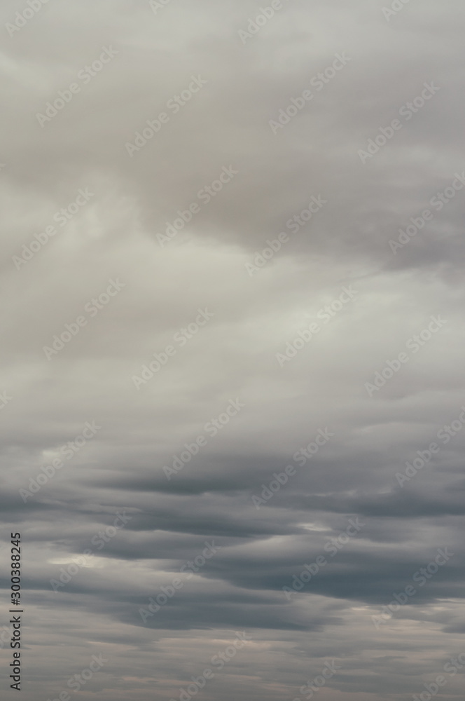 Soft background with stratus clouds. Dramatic cloudscape under cinematic color filter.