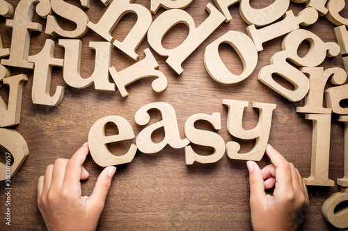 Slika na platnu Child's Hand Arrange Easy Word