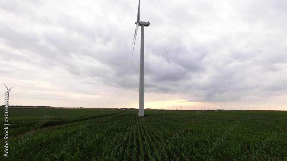 Aerial, spinning wind turbine on overcast day Aerial, spinning wind turbine on overcast day
