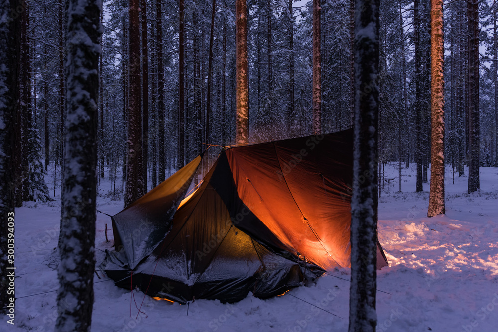 A traditional loue-shelter in a snowy forest in Finland Photos | Adobe Stock