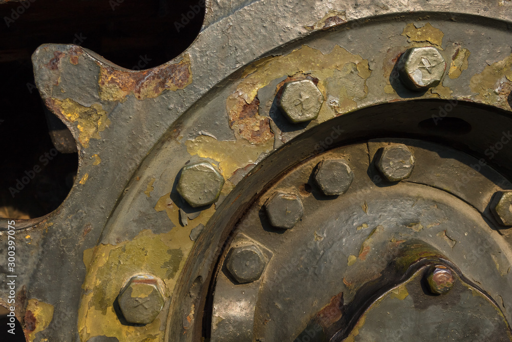 Fragment of tank wheel with exfoliated paint and rivets Fragment of tank wheel with exfoliated paint and rivets
