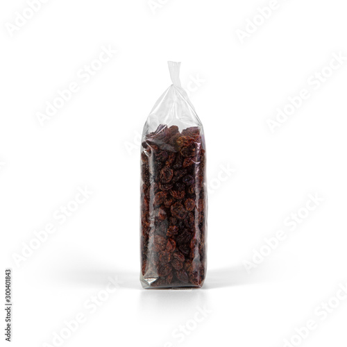Raisins in transparent plastic bag isolated on white background. Packaging template mockup collection. Stand-up Side view. © goolyash