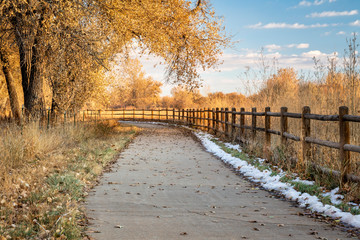 late fall scenery on a bike trail with cottonwood trees