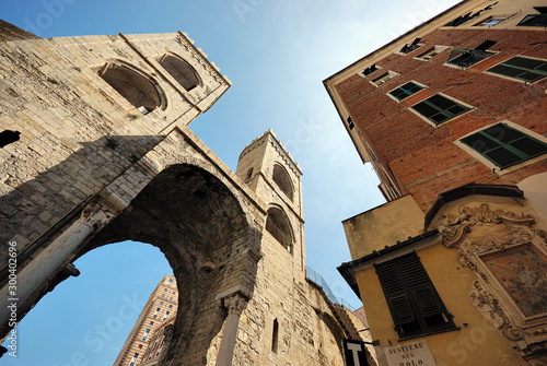 The old part of the Italian city of Genova, a brick arch extending high into the sky.