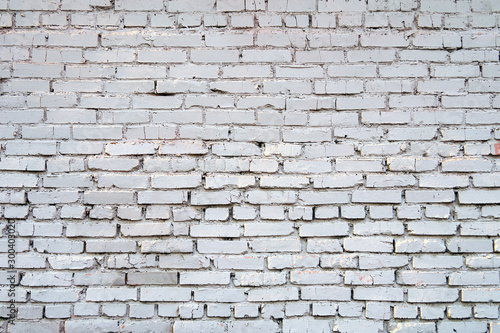 White brick wall. Empty horizontal background with old bricks and mortar. Copy space for text